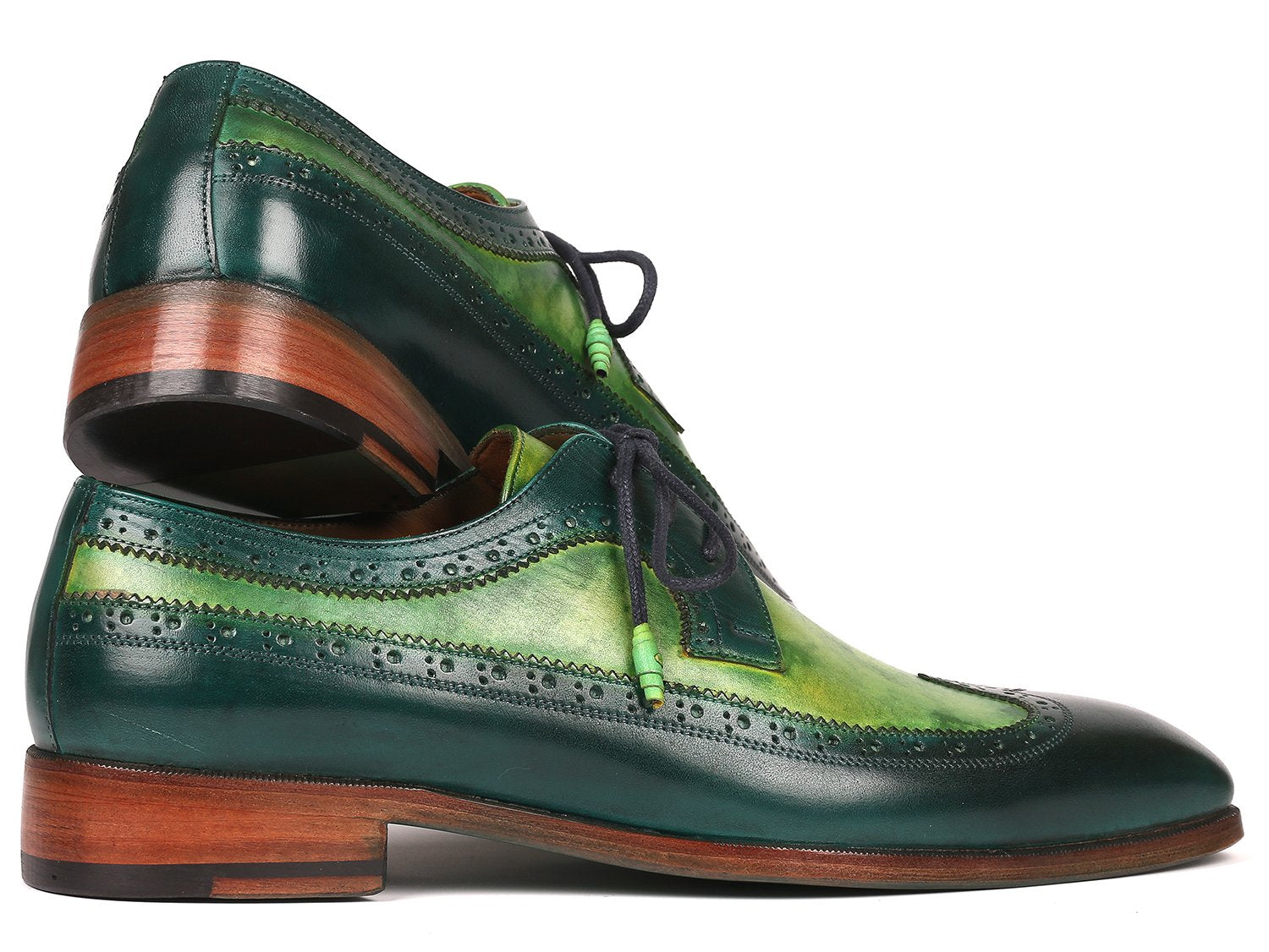 The Paul Parkman Green Dual Tone Wingtip Derby Shoes - 6931GRN is an elegant pair of shoes crafted from exquisite hand-painted calfskin, featuring a sophisticated green and black leather design with contrasting black laces and brown soles for a unique touch.