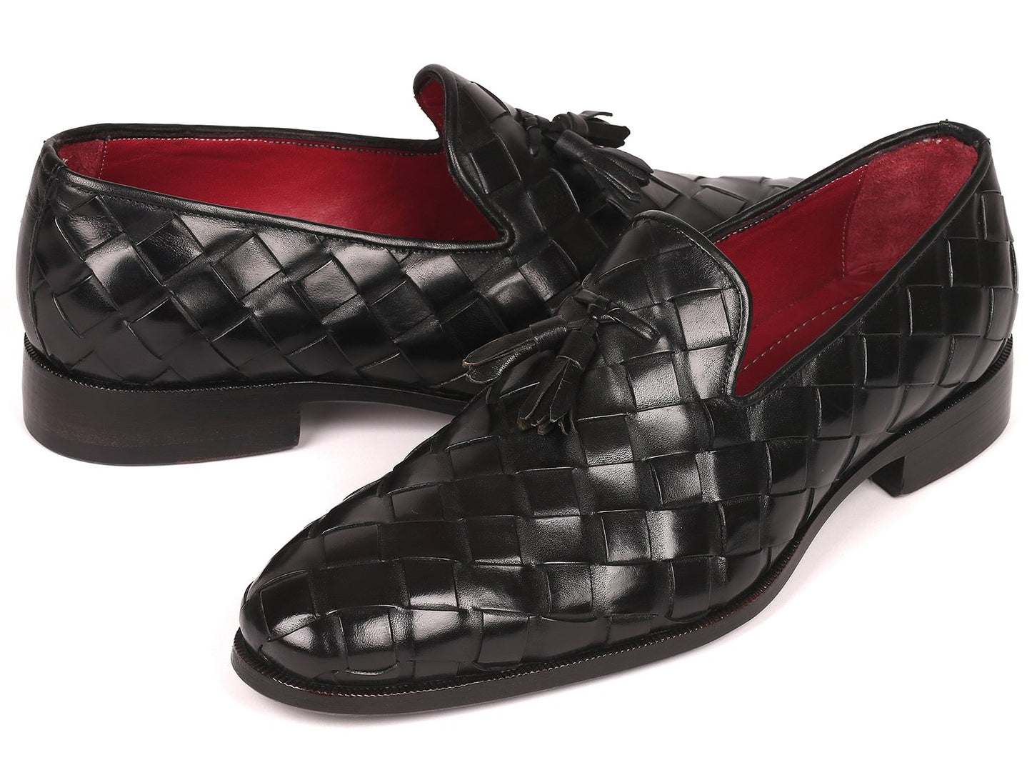 Discover the Paul Parkman Big Braided Tassel Loafers in Black - 6623-BLK, a pair of elegant black loafers featuring a striking red interior lining. These bespoke shoes represent unmatched luxury, combining classic design with customized craftsmanship from the renowned brand Paul Parkman.