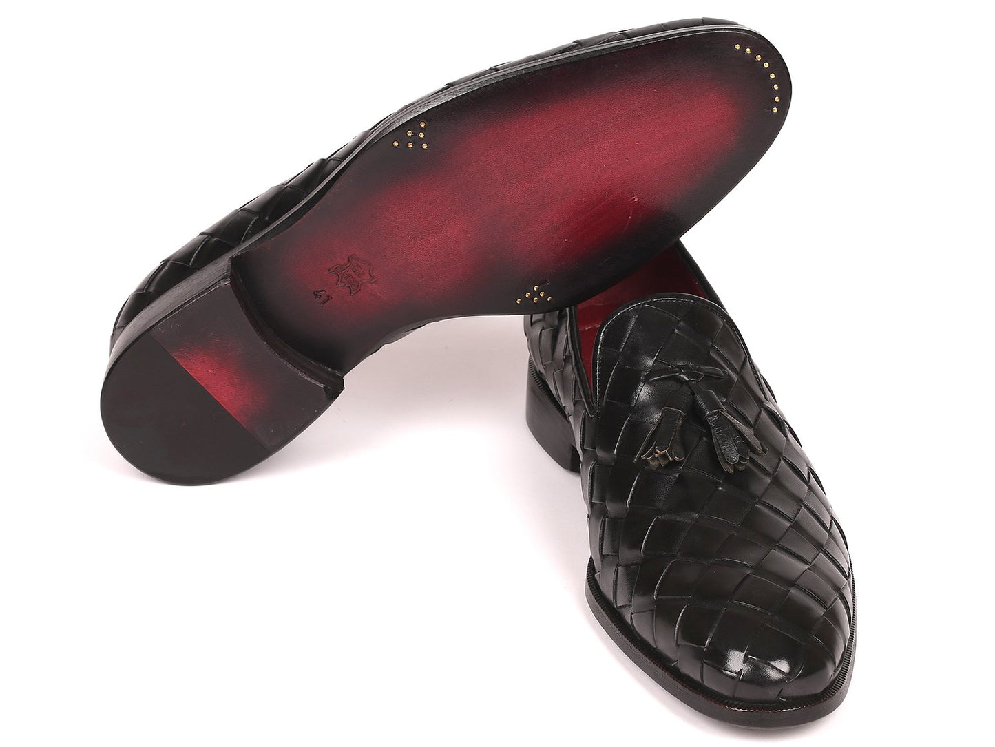 Discover the Paul Parkman Big Braided Tassel Loafers in Black - 6623-BLK, a pair of elegant black loafers featuring a striking red interior lining. These bespoke shoes represent unmatched luxury, combining classic design with customized craftsmanship from the renowned brand Paul Parkman.