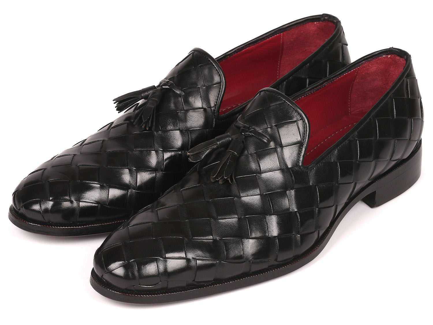 Discover the Paul Parkman Big Braided Tassel Loafers in Black - 6623-BLK, a pair of elegant black loafers featuring a striking red interior lining. These bespoke shoes represent unmatched luxury, combining classic design with customized craftsmanship from the renowned brand Paul Parkman.