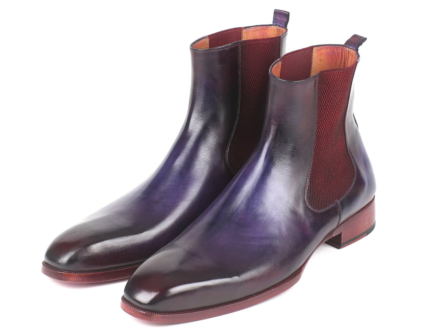 A pair of Paul Parkman Navy & Purple Chelsea Boots - BT552PUR featuring polished purple leather, red ankle panels, and low heels, crafted from hand-painted leather for a unique touch.