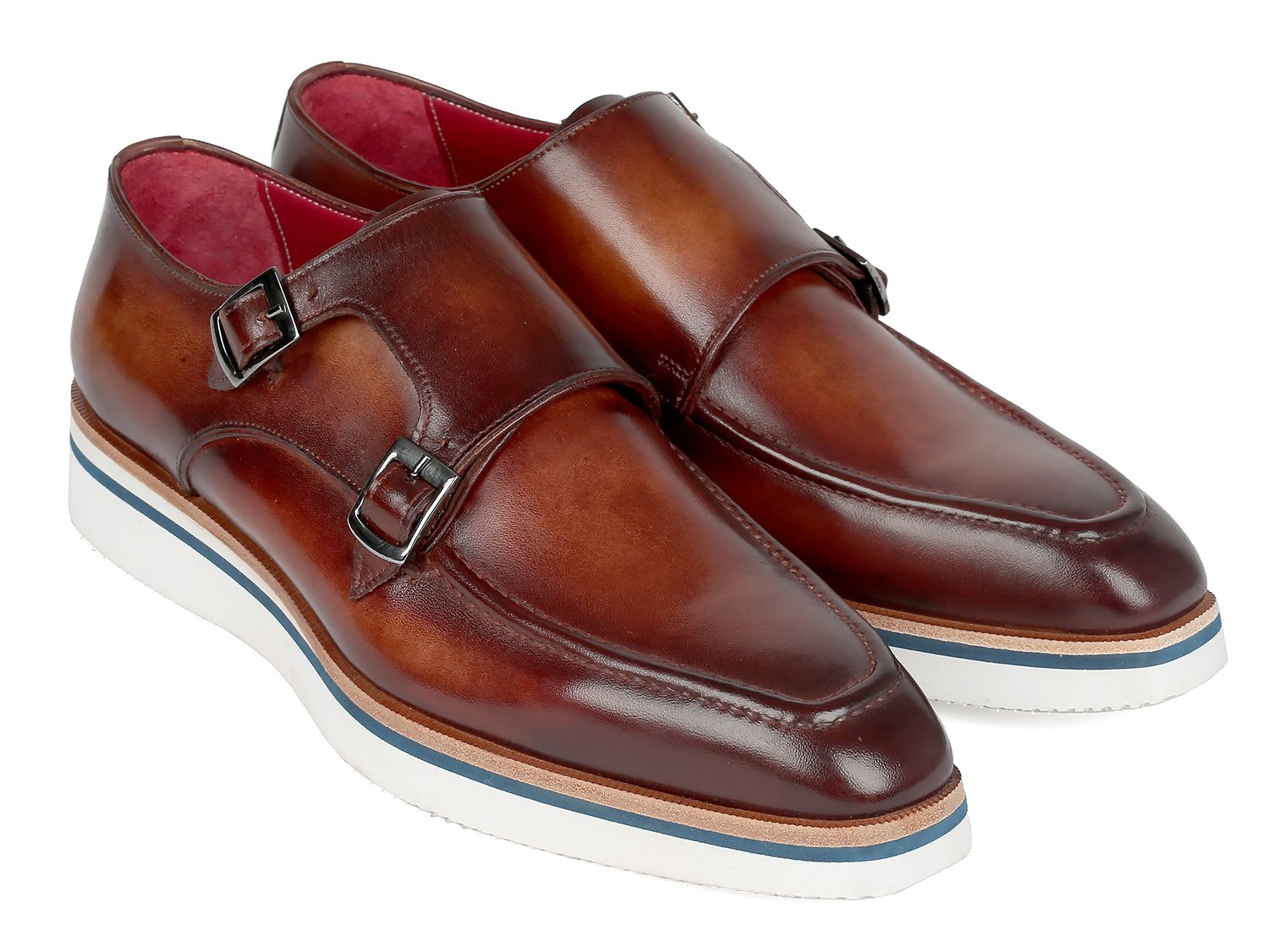 The Paul Parkman Smart Casual Monkstrap Shoes in brown leather feature a crisscross buckle design and white soles, embodying a smart casual style.