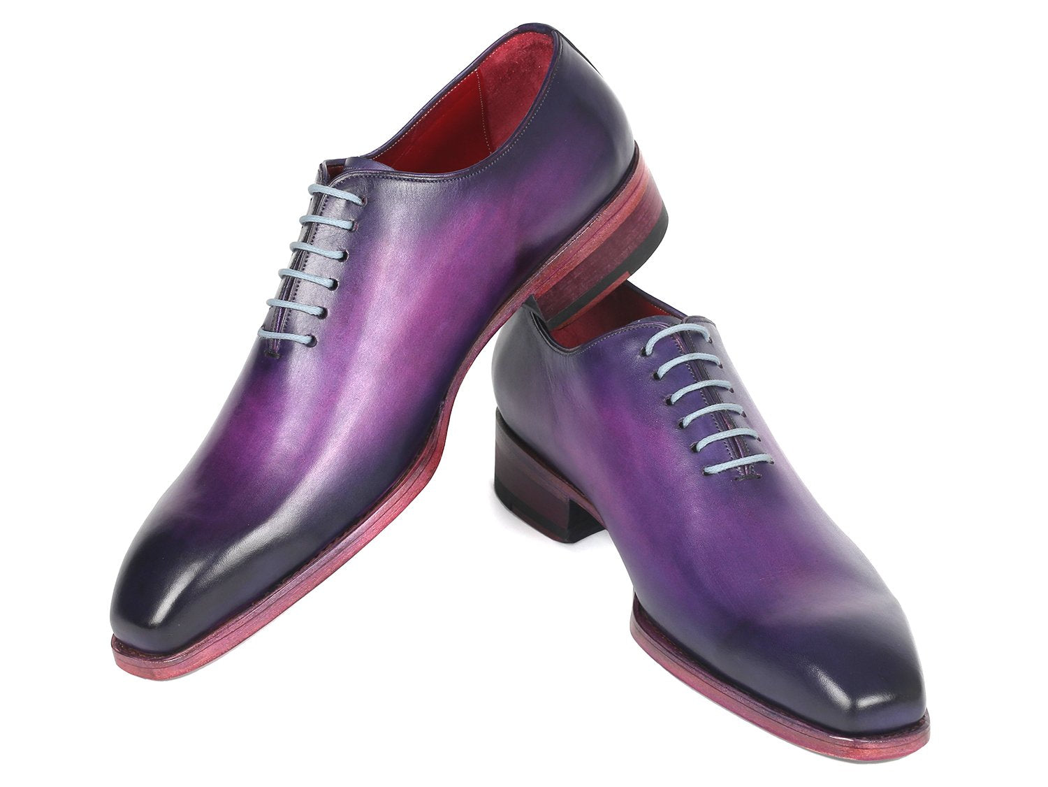 The Paul Parkman Goodyear Welted Wholecut Oxfords in a purple hand-painted design feature light grey laces and a red interior, presented at an angle on a white background. These shoes exemplify meticulous detail and superior craftsmanship.