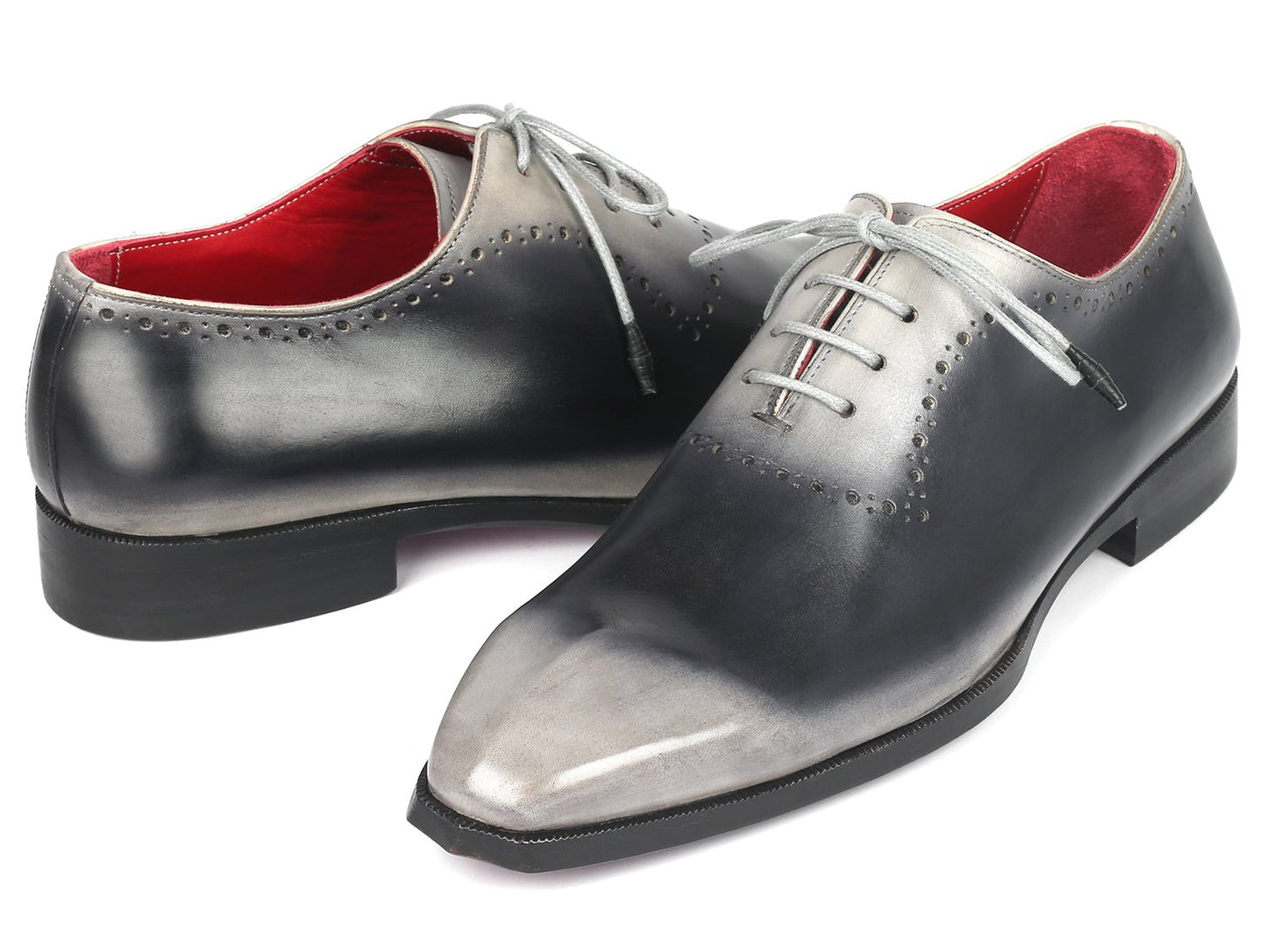 Introducing the Paul Parkman Gray Hand-Painted Oxfords - AG445GRY: a pair of glossy, hand-painted leather dress shoes crafted by Paul Parkman. These shoes feature a stunning gradient of gray and black with striking white laces and a vibrant red interior. Made-to-order with an exclusive hue, they make a statement in any formal setting.