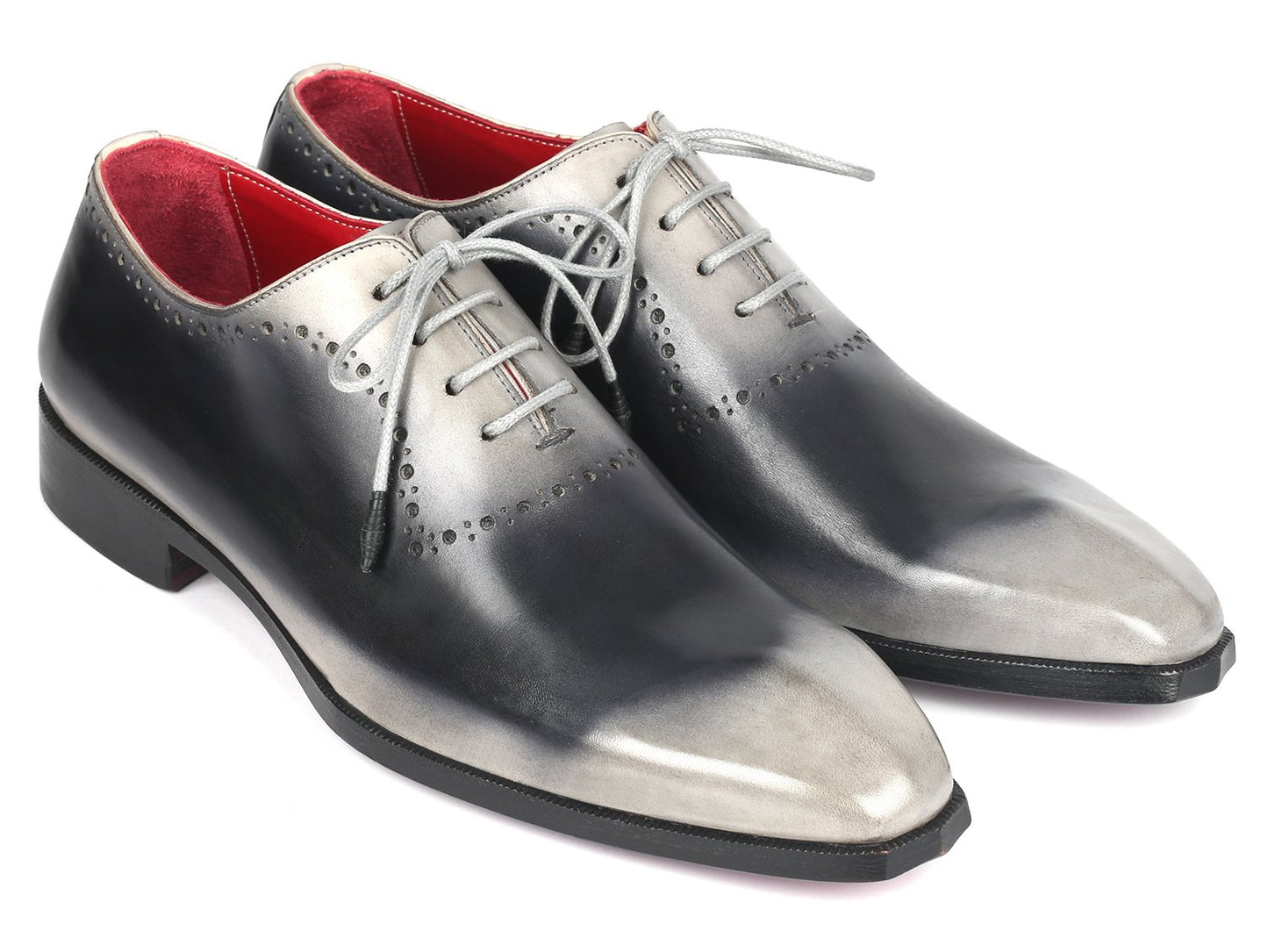 Introducing the Paul Parkman Gray Hand-Painted Oxfords - AG445GRY: a pair of glossy, hand-painted leather dress shoes crafted by Paul Parkman. These shoes feature a stunning gradient of gray and black with striking white laces and a vibrant red interior. Made-to-order with an exclusive hue, they make a statement in any formal setting.