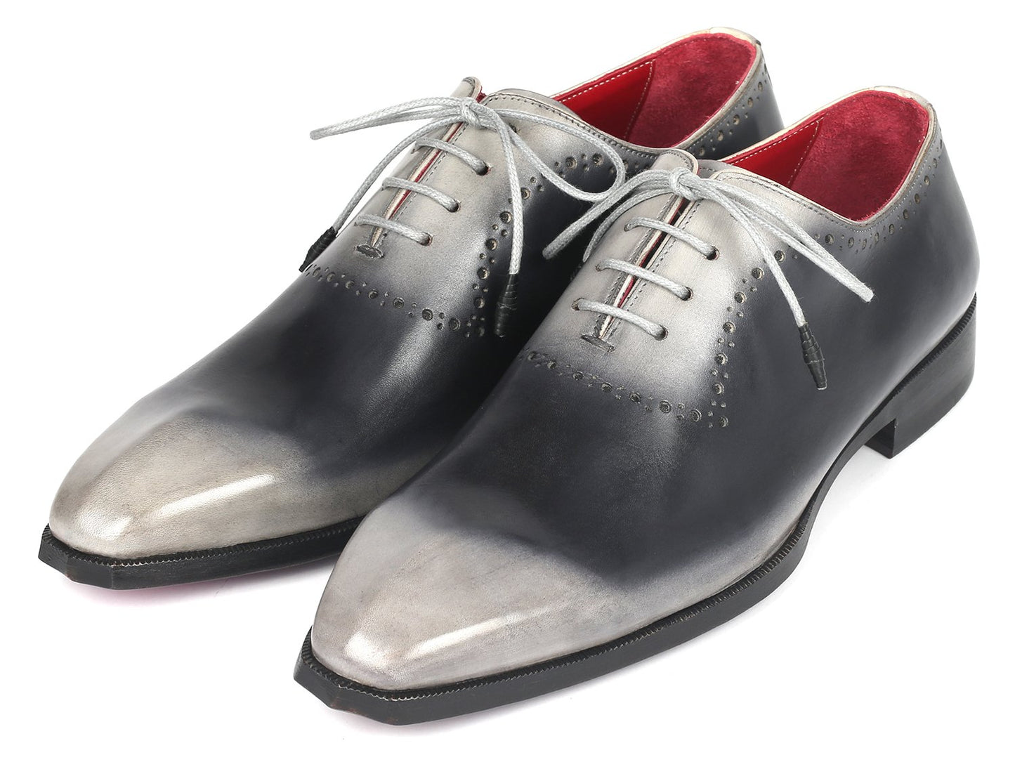 Introducing the Paul Parkman Gray Hand-Painted Oxfords - AG445GRY: a pair of glossy, hand-painted leather dress shoes crafted by Paul Parkman. These shoes feature a stunning gradient of gray and black with striking white laces and a vibrant red interior. Made-to-order with an exclusive hue, they make a statement in any formal setting.