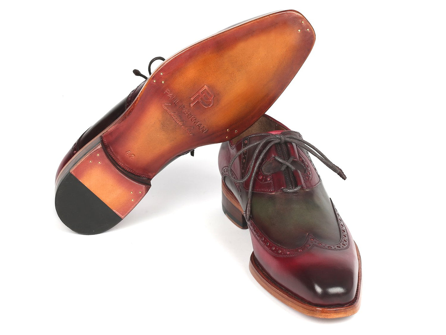 Introducing the Paul Parkman Goodyear Welted Ghillie Lacing Brogues in Green & Bordeaux (2955-GRB), a stunning pair of shoes crafted from hand-painted leather with intricate wingtip brogue detailing. These elegant shoes feature brown soles and black laces, and are expertly constructed using Goodyear welt techniques for unmatched craftsmanship.