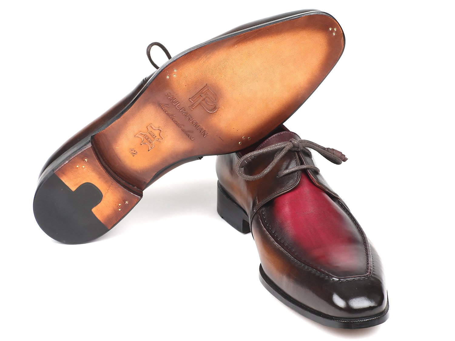 The Paul Parkman Brown & Bordeaux Dual Tone Apron Derby Shoes - 33BB12 are polished dress shoes crafted from calfskin leather in brown and red tones, featuring laces and an artful hand-painted finish displayed at an angle.