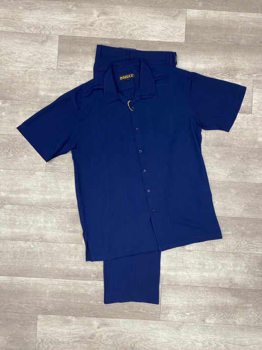 A navy short-sleeve button-up shirt and matching microfiber pants from the Inserch 2pc 9356 collection are laid flat on a light wood floor.