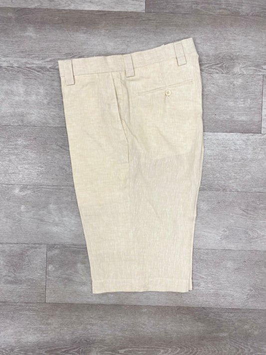 Inserch's Premium Linen Flat Front Shorts in Oatmeal, made from exquisite Belgian Flax, on a gray wood floor, are an essential addition to your summer wardrobe.