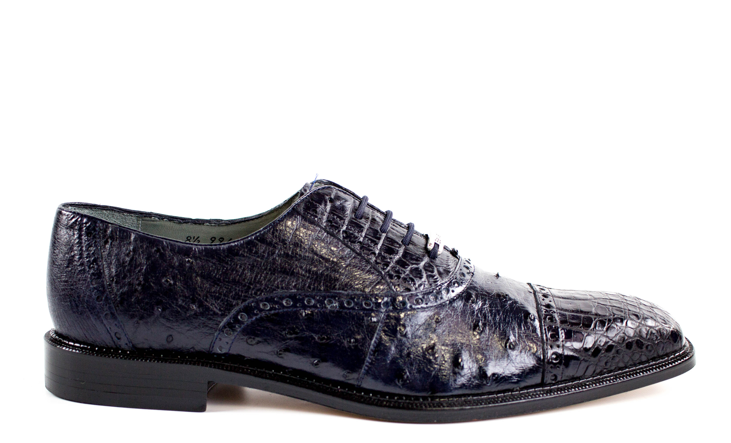 The Belvedere - Onesto II genuine ostrich and crocodile dress shoe in navy, showcasing a textured, glossy finish with a subtle crocodile pattern and a low black heel, is displayed against a white background.