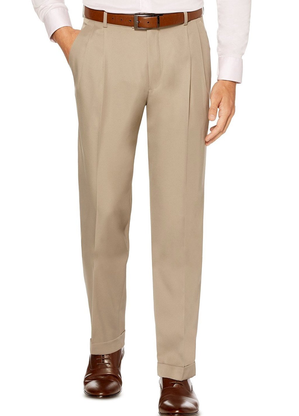 A man wearing Vinci Suits' khaki pleated dress pants, the Vinci Regular Leg Pleated Pre-Hemmed With Cuffs Dress Pants (Khaki) OP-900, known for their wrinkle-resistant fabric ensuring all-day freshness, paired with a brown belt, brown shoes, and a crisp white shirt.