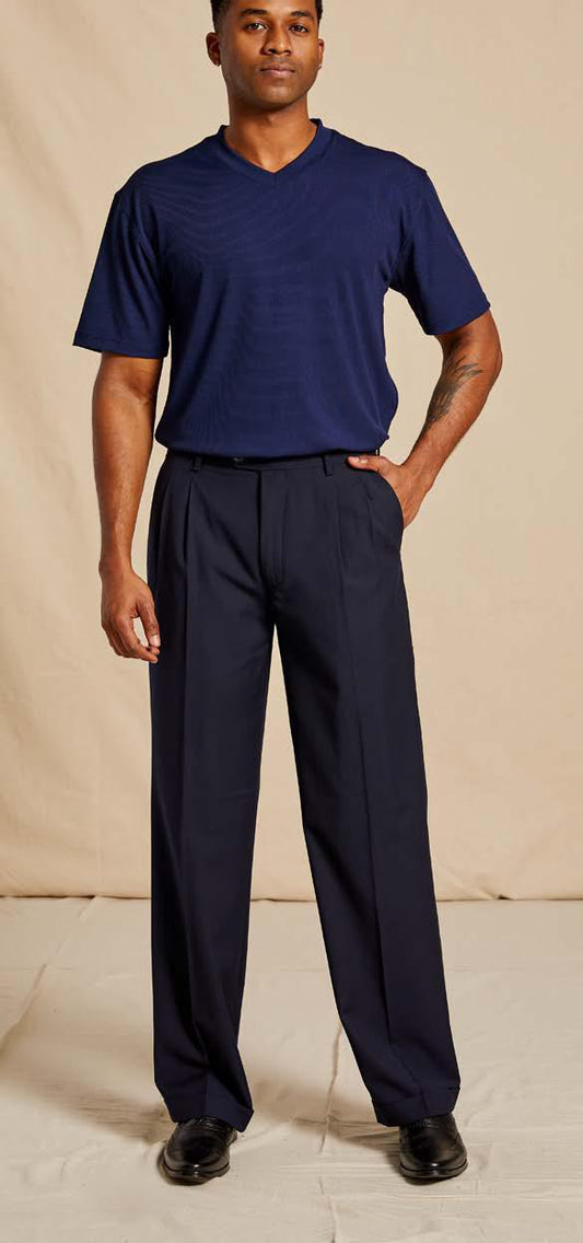 A person wearing the Inserch Regular Fit Two Pleat T/R Pant P1199S-11 in navy blue stands with one hand in a pocket against a neutral background.