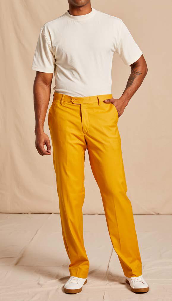 A person wearing a white t-shirt and the Inserch Modern Fit Flat Front T/R Pant P3199S-38 in gold, paired with white shoes, stands on a neutral background.