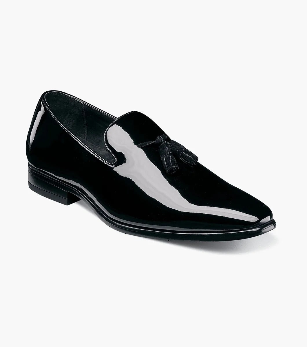 The Stacy Adams PHOENIX Plain Toe Tassel Slip On (Black Patent - 21011-004) is a stylish black loafer crafted with a polished patent upper and low heel, enhanced by a memory foam footbed for superior comfort.