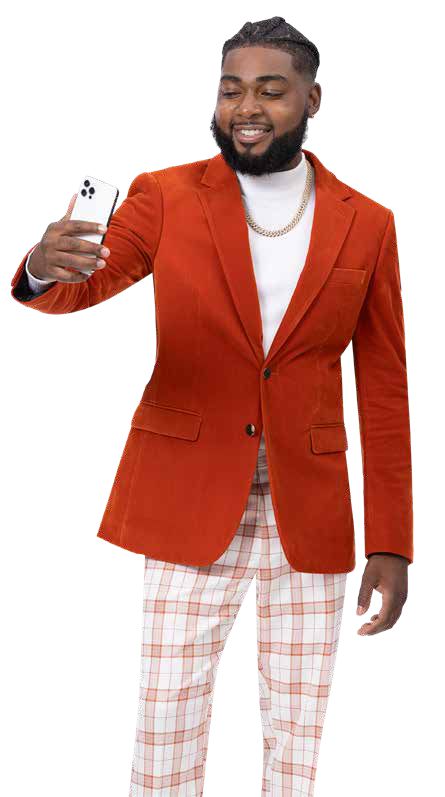 A man in an orange blazer and EJ Samuel Rust Plaid Pants PL105 takes a selfie with a smartphone.