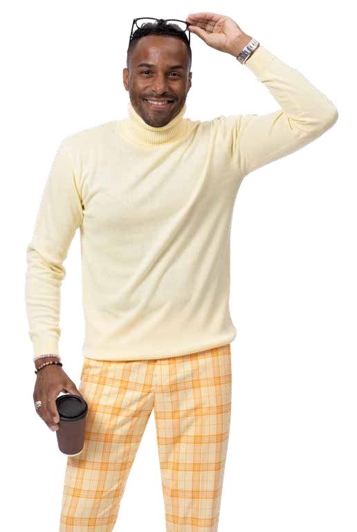 A person in a light yellow turtleneck and EJ Samuel Orange Plaid Pants PL106 holds a coffee cup and adjusts sunglasses with a smile.