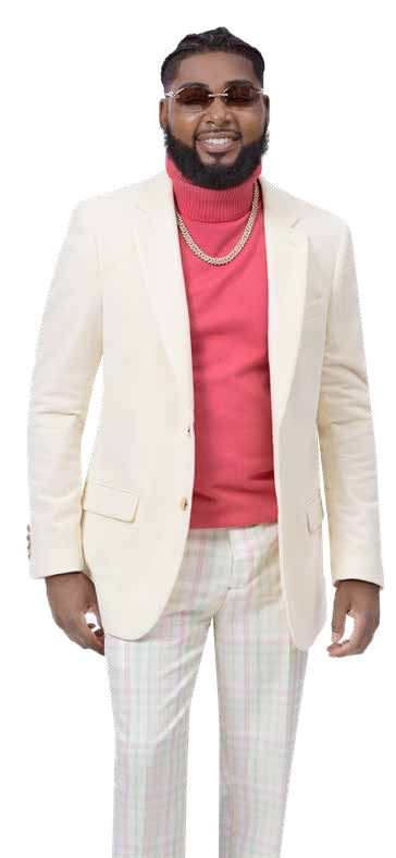 A man in sunglasses showcases a modern fit, smiling as he wears his cream suit jacket over a red turtleneck, complemented by the stylish EJ Samuel Mint/Pink Plaid Pants PL115.