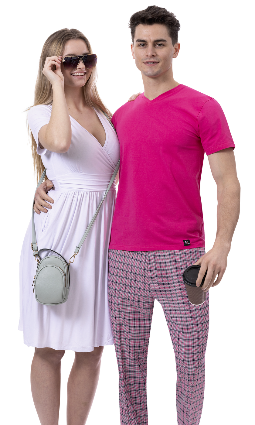 A woman in a white dress and sunglasses stands next to a man wearing the EJ SAMUEL modern fit pink shirt with EJ Samuel Pink Plaid Pants PL145, holding a coffee cup.