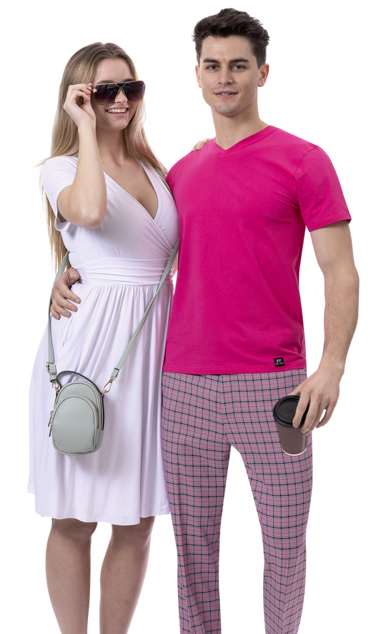 A woman in a white dress and sunglasses stands next to a man wearing the EJ SAMUEL modern fit pink shirt with EJ Samuel Pink Plaid Pants PL145, holding a coffee cup.