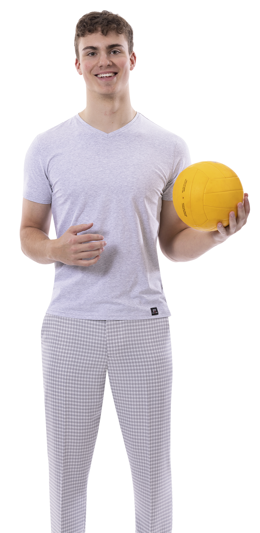 A person in EJ Samuel's gray "PL148" plaid pants holds a yellow volleyball, smiling at the camera.