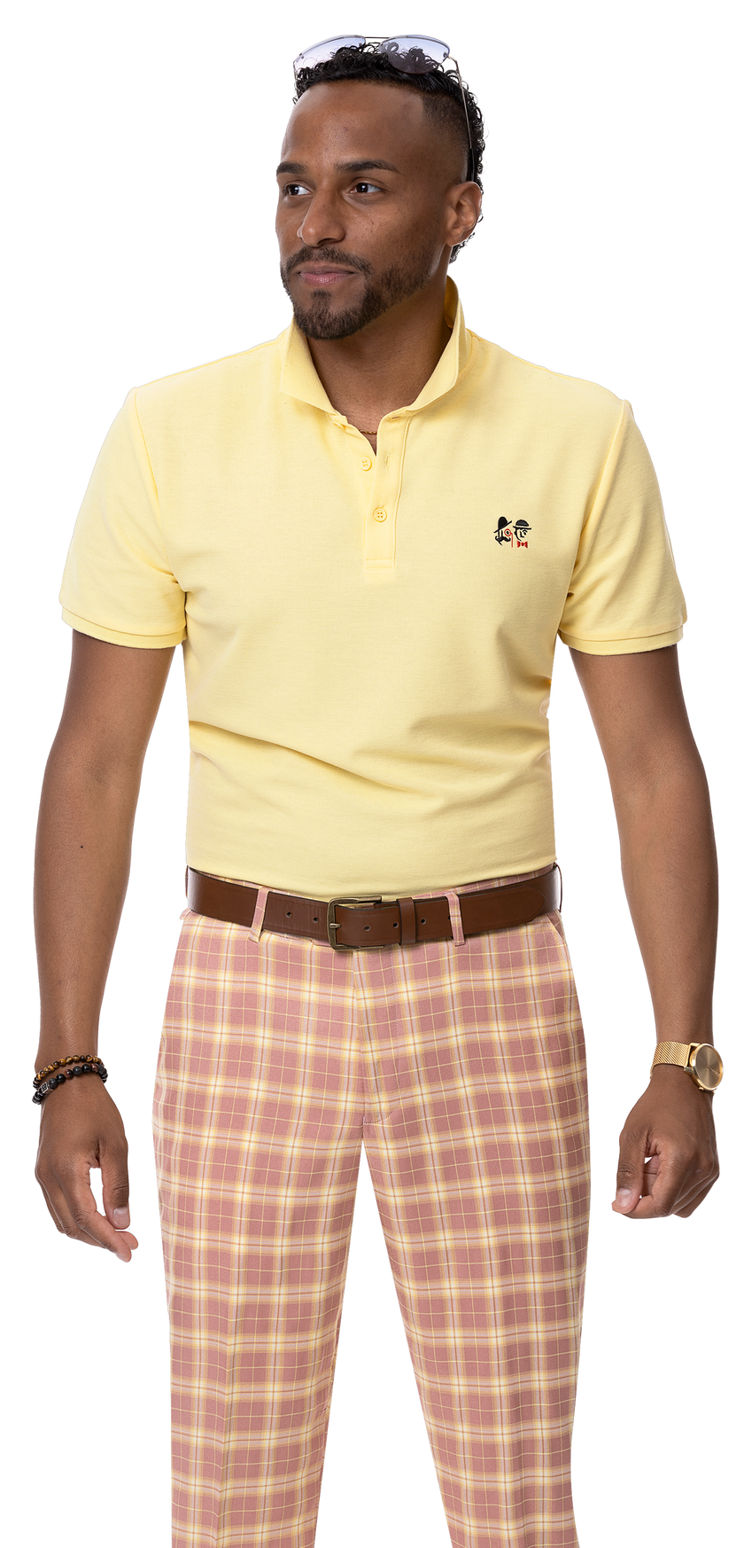 A man in a modern-fit yellow polo shirt and EJ Samuel Pink Plaid Pants PL25 stands with his hands at his sides.