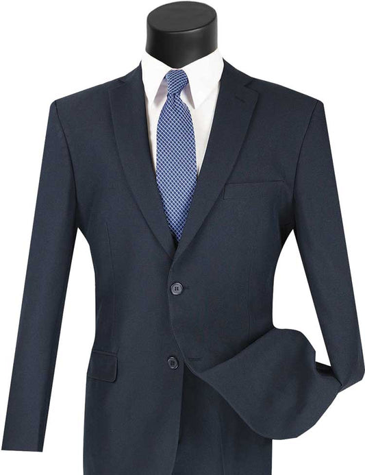 A stylish Vinci Suits mannequin features the wrinkle-resistant Vinci Slim Fit 2 Piece 2 Button Business Suit in navy, paired with a crisp white shirt and a patterned blue tie.