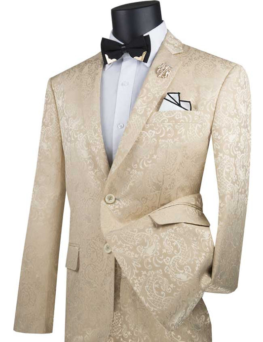 A beige slim-fit tuxedo jacket from the Vinci Slim Fit 2 Piece Single Breasted Suit (Beige) S2F-1 by Vinci Suits, styled with a paisley pattern, presents a luxurious wool-like texture and is complemented by a black bow tie, white dress shirt, pocket square, and boutonniere on a slender mannequin.