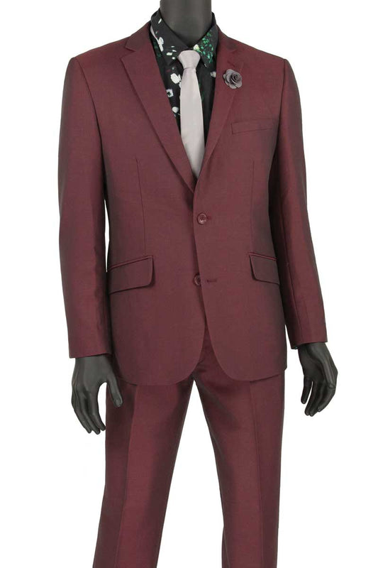 The mannequin displays the Vinci Slim Fit 2 Piece Suit by Vinci Suits, featuring a stylish, wrinkle-resistant burgundy suit paired with a floral shirt and light gray tie. This ensemble includes a single-breasted jacket and is adorned with a flower lapel pin, radiating elegance.