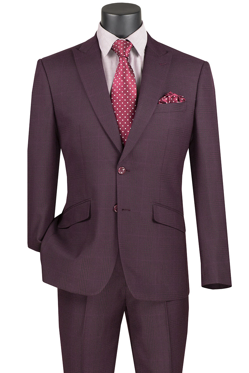 Displayed on a mannequin is the Vinci Slim Fit Suit with Peak Lapel and Stretch Armhole in Burgundy by Vinci Suits. It features a stylish white shirt, a red polka dot tie, and a matching pocket square. The sharp peak lapel adds an elegant touch to this ensemble.