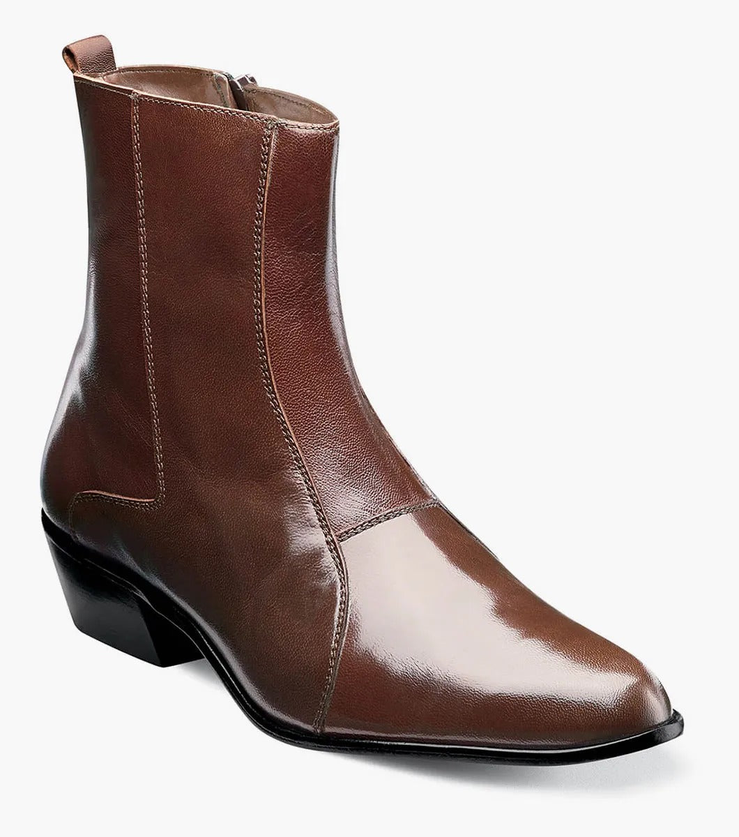 The Stacy Adams - SANTOS Slip On Boot in Cognac, model 24855-221, showcases kidskin leather for a chic combination of comfort and style, complemented by its low heel and sophisticated brown hue.