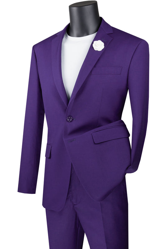 A mannequin displaying the Vinci Suits' elegant slim fit option, the Vinci Slim Fit 2 Piece 2 Button Suit in purple (SC900-12), paired with a crisp white shirt and adorned with a delicate white flower in the pocket. This blazer and pants ensemble ensures wrinkle-resistant sophistication for any occasion.