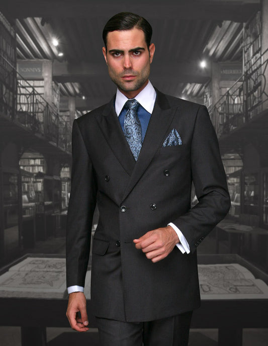 A man in a charcoal double-breasted suit from Statement Clothing, perfectly tailored, accompanied by a blue tie and pocket square, stands in an ornate library setting.