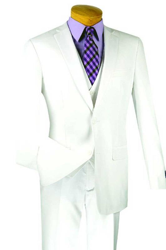 Introducing the Vinci Slim Fit 3 Piece 2 Button Suit in crisp white (SV2900) from Vinci Suits, displayed with a vibrant purple shirt and a striking purple and black checkered tie on the mannequin. Crafted with wrinkle-resistant fabric, this stunning ensemble ensures impeccable style throughout the day, making it an excellent choice for any occasion.