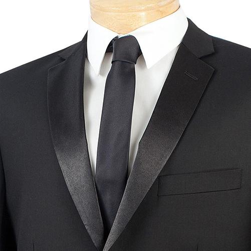 The mannequin is adorned with a stylish black Vinci Slim Fit 2 Piece 2 Buttons Design Tuxedo (T-SC900), featuring a satin shawl collar. Accompanied by a matching tie and a pristine white dress shirt, this elegant ensemble from Vinci Suits offers wrinkle resistance, ensuring you look flawless at any occasion.