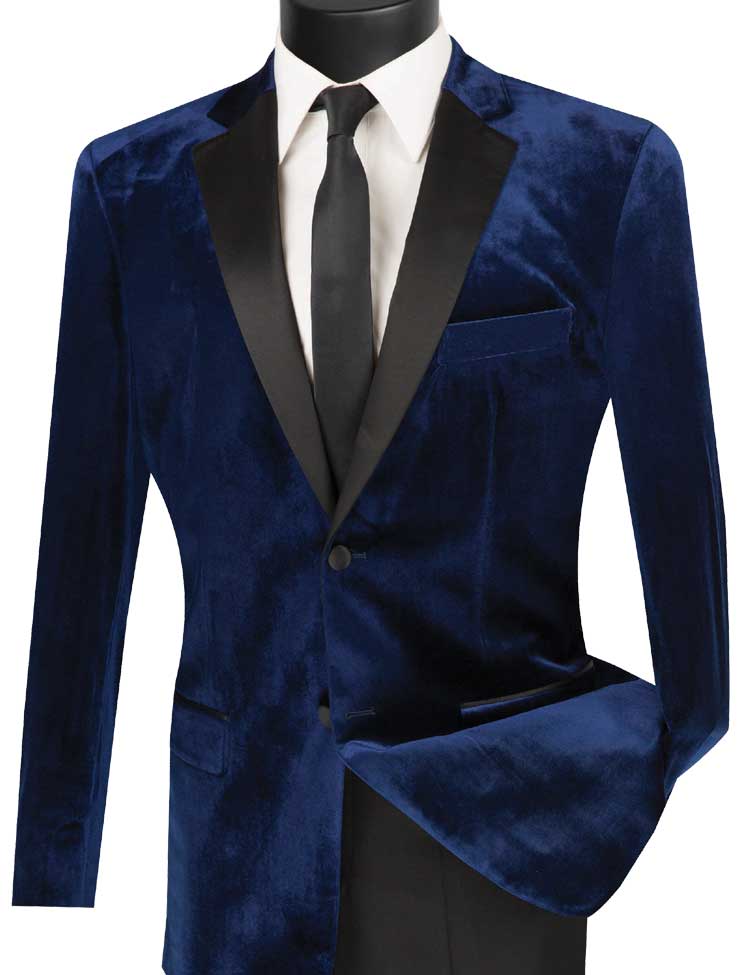 The Vinci Slim Fit 2 Piece Velvet Tuxedo in navy, featuring a black satin lapel, combines elegantly with a crisp white shirt and black tie on a mannequin. This look is perfectly completed with slim-fit wool-blend pants from the esteemed brand Vinci Suits.