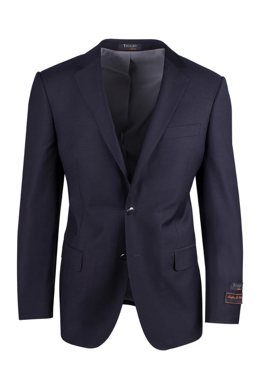 The Tiglio Luxe Novello Navy Blue Modern Fit Blazer (TIG1002) is made from pure wool and Italian fabrics and features a single-button closure, notched lapels, and two front pockets, showcased on a white background. This exquisite piece is the perfect addition to any men's clothing collection.