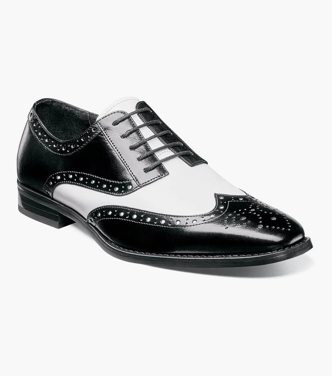 The Stacy Adams TINSLEY Wingtip Oxford in black with white, product number 25092-111, is a stylish shoe crafted from buffalo leather featuring decorative perforations and black laces.