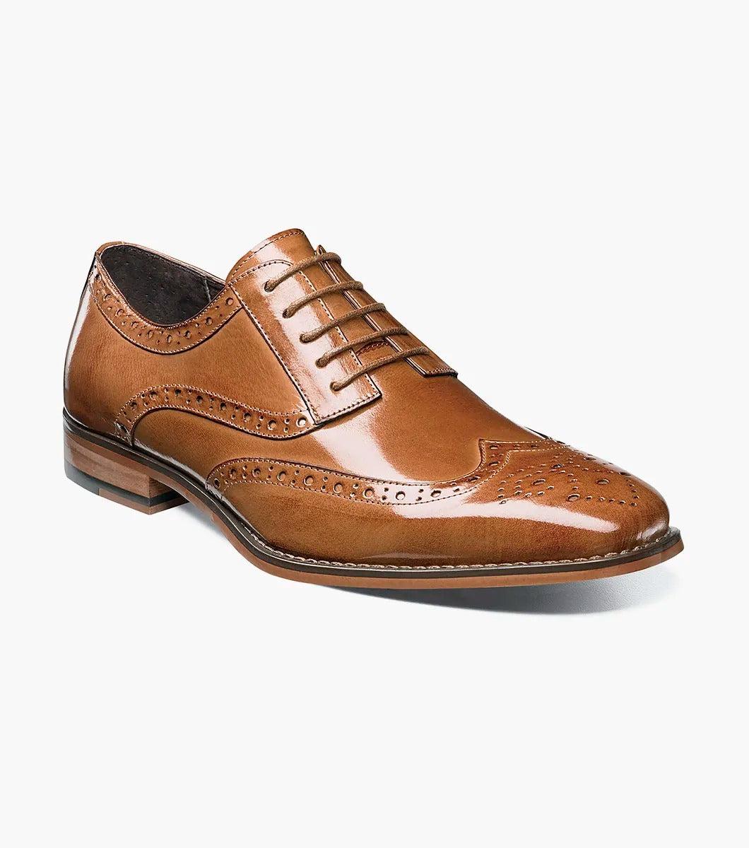 Stacy Adams' TINSLEY Wingtip Oxford in tan features brogue detailing with decorative perforations and laces, seen from the side on a white background.