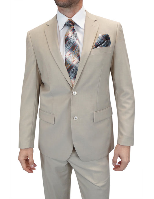 A sophisticated ensemble from Statement Clothing features a man in a tailored beige suit, identified as the STATEMENT CLOTHING | TS-02-TAN. This elegant look is enhanced by a crisp white shirt and a stylish patterned tie, with a coordinated pocket square elegantly tucked into the suit's breast pocket. The photo, skillfully cropped at the neck and below the waist, highlights the refined proportions of this attire.