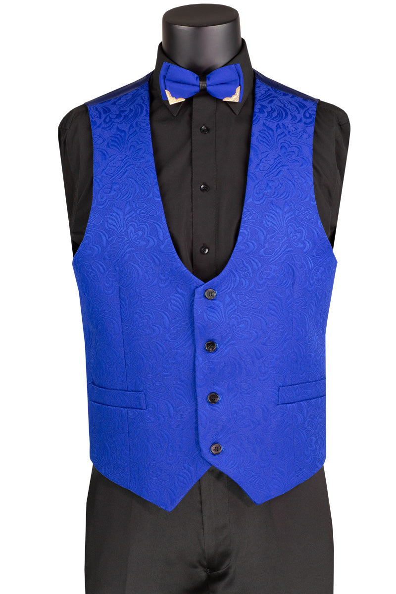 A mannequin features the Vinci Slim Fit 3 Piece Single Button Jacquard Fabric Tuxedo (Royal) TVSJ-1 by Vinci Suits, highlighted by a royal blue patterned suit with a matching vest and blazer. It's paired with a black shirt and pants, accentuated with a blue bow tie and gold chain on the lapel.