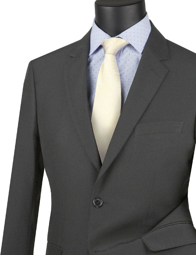 Displayed on the mannequin is a Vinci Suits medium gray ultra-slim fit single-breasted jacket, styled with a light blue polka-dot shirt and complemented by a cream-colored tie.