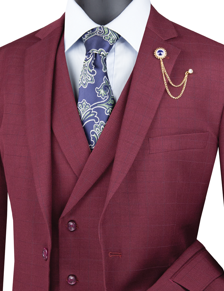 Introducing the Vinci Regular Fit Glen Plaid 2 Button 3 Piece Suit in Burgundy (V2RW-13) by Vinci Suits, elegantly paired with a patterned blue tie and a gold chain lapel pin for a sharp, timeless look.