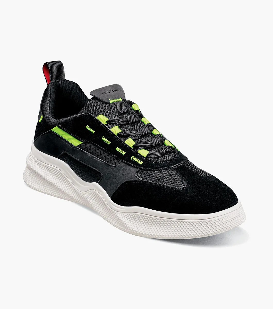 The Stacy Adams Ventura T-Toe Lace Up Sneaker in Black Multi, model 25514-009, combines black and green hues with a white sole for a stylish sneaker design set against a simple backdrop. Crafted for maximum comfort, it incorporates the cutting-edge RedZone removable footbed to make each step feel perfect.