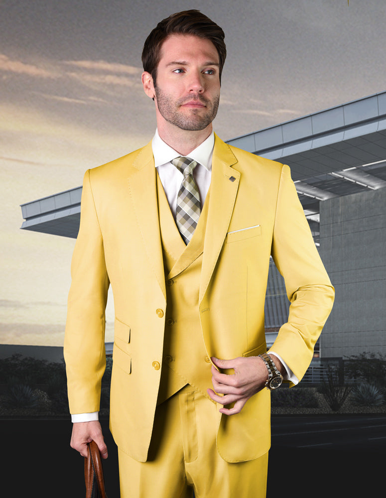 A man dressed in ZARGALA-YELLOW from Statement Clothing, featuring a yellow suit with a plaid tie and a modern fit, stands in front of a sleek building, complemented by an Italian wool double-breasted vest.