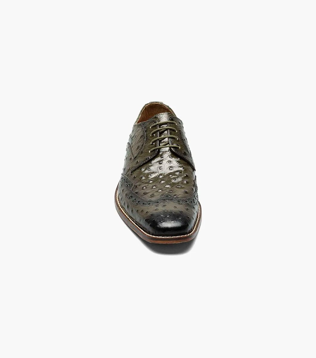 The Stacy Adams GENNARO Wingtip Oxford in olive (25537-303) is a refined shoe crafted from ostrich quill print leather, showcasing a textured pattern with brogue detailing, and includes a RedZone removable footbed for enhanced comfort.