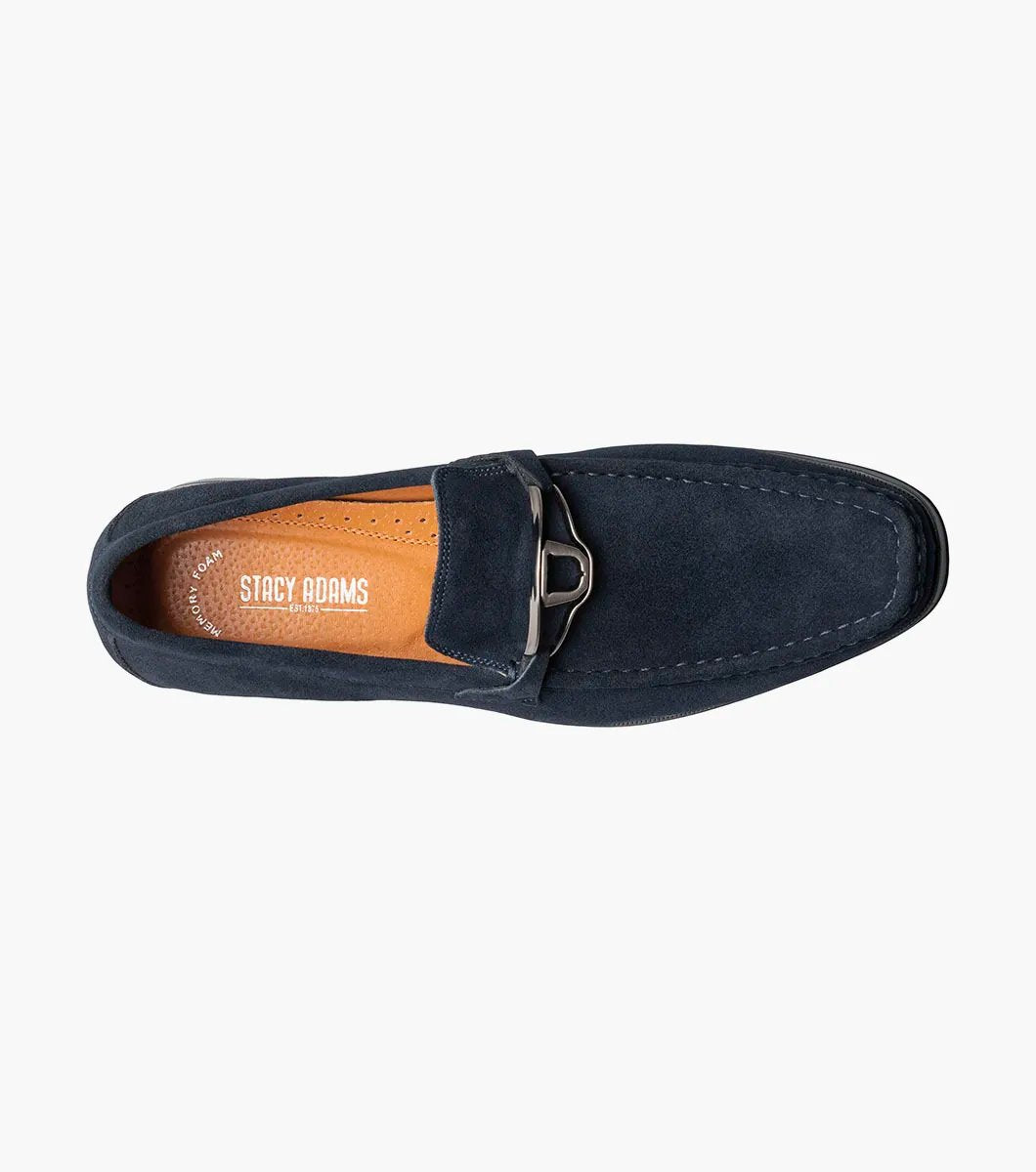 Stacy Adams introduces the PALLADIAN Moc Toe Slip On in Navy Suede (25549-415), showcasing a soft suede upper, metallic buckle detail, and black sole with a fully cushioned insole for exceptional comfort.