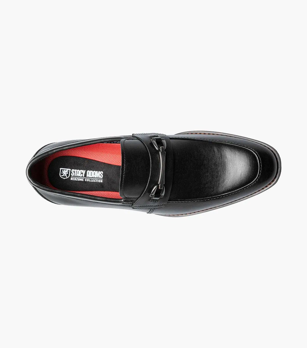 The Stacy Adams KAYLOR Moc Toe Bit Slip On in black (model 25572-001) is a sophisticated leather loafer from STACY ADAMS, highlighted by a sleek metal buckle, wooden heel, and premium leather upper. Perfectly set against a white background, it features the supportive RedZone footbed for exceptional comfort.