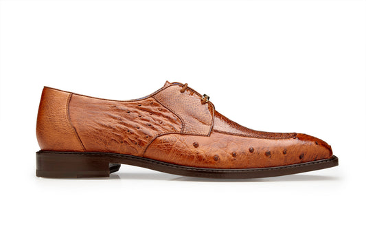 Side view of the Belvedere - Bolero dress shoe in Antique Almond, showcasing its brown genuine ostrich leg texture with intricate detailing and a low heel, complete with a leather insole, set against a white background.