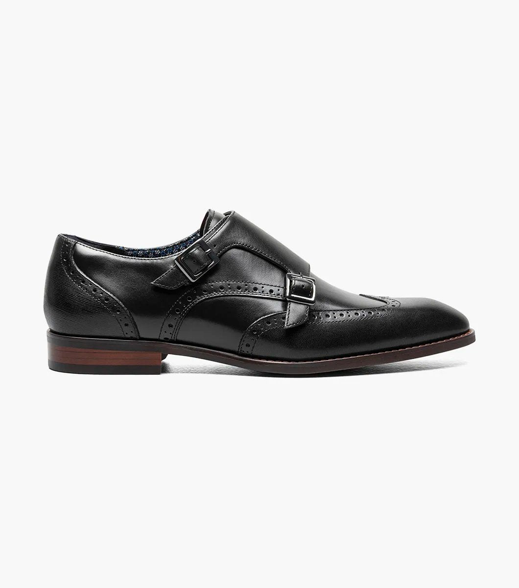 The Stacy Adams KARSON Wingtip Double Monk Strap in black, model 25570-001, features decorative perforations and dual buckles for a stylish look.